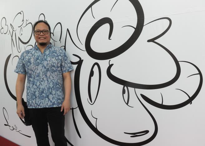 Cartoonist Loic Hsiao at an exhibition