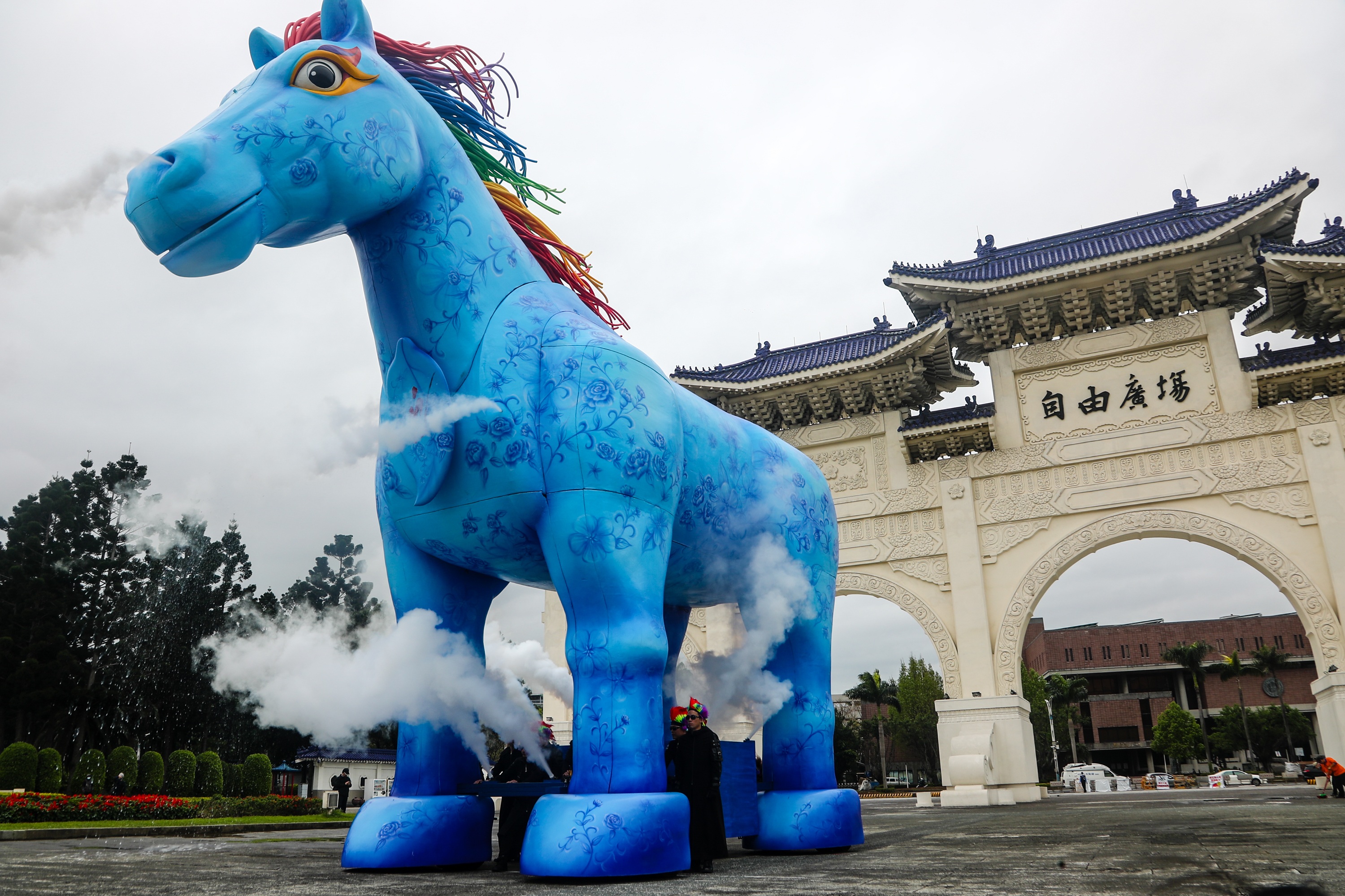 Paper Windmill Theatre exhibits giant blue horse statue in front of Sun Yat-sen Memorial Hall