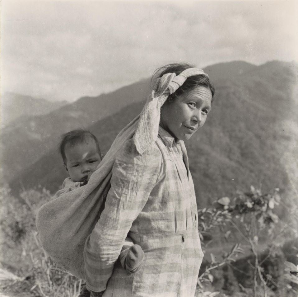 Woman Carrying a Child